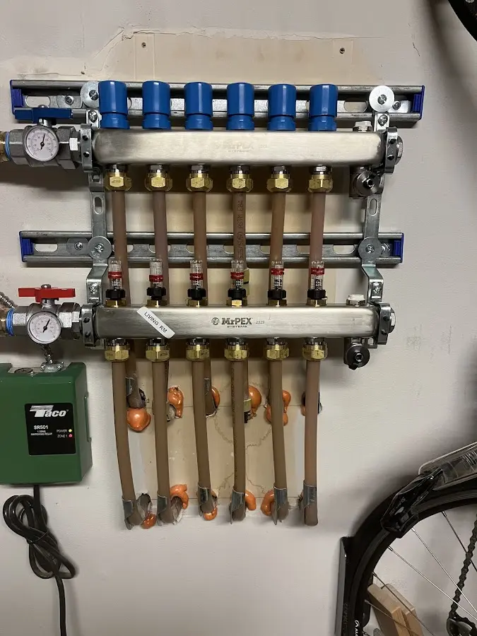 Plumber performing Water Heater Repair at a residential property in SeaTac